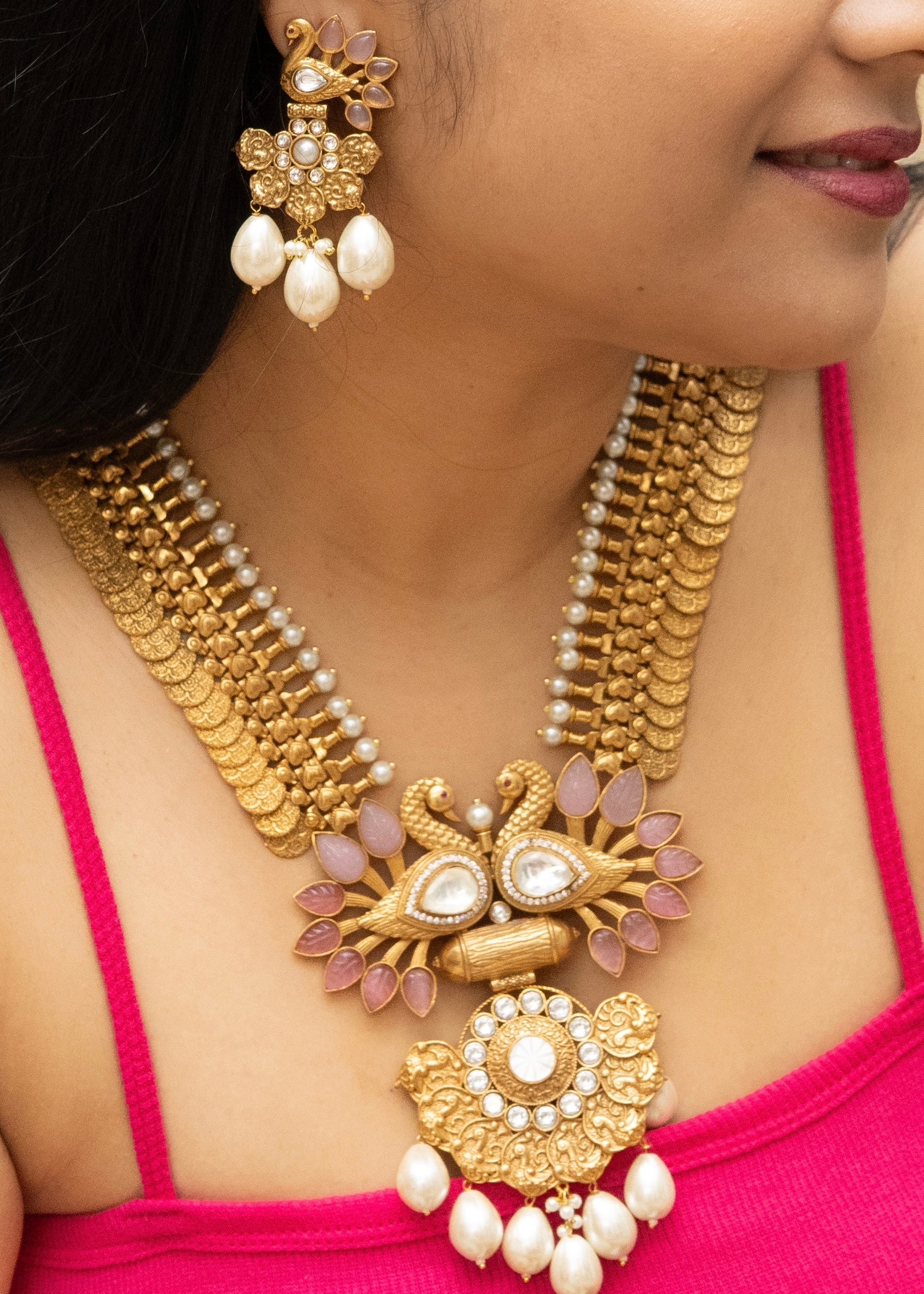 long coin haram necklace with peacock detailing and antique gold styling